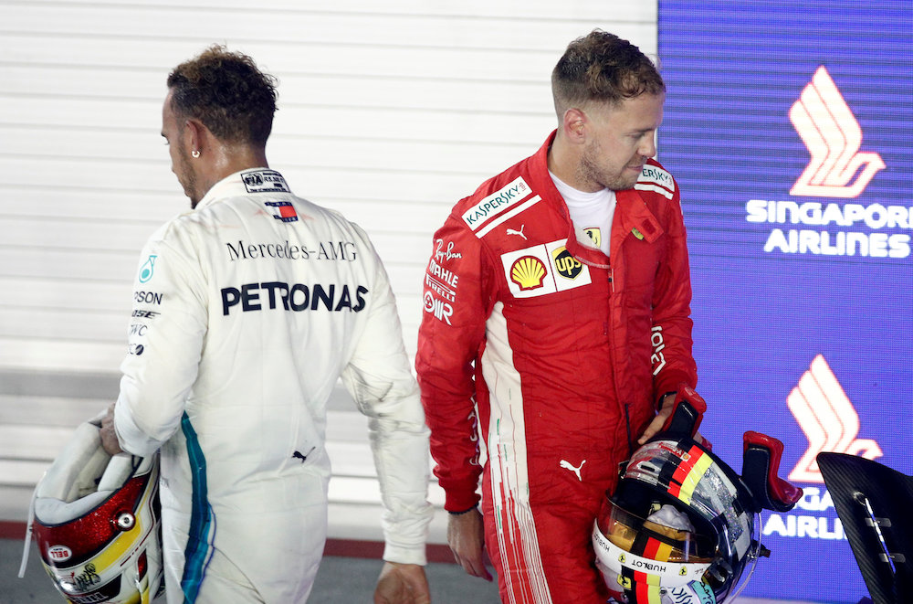 Mercedesu00e2u20acu2122 Lewis Hamilton and Ferrariu00e2u20acu2122s Sebastian Vettel are seen after the Singapore Grand Prix September 16, 2018. u00e2u20acu201d Reuters pic
