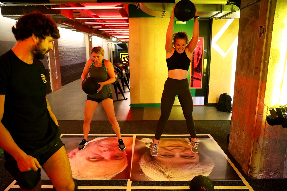 A gym member drop balls on images of Britainu00e2u20acu2122s Prime Minister Theresa May and Labour leader Jeremy Corbyn during a Brexfit gym class at Gym Box in London September 27, 2018. u00e2u20acu201d Reuters pic