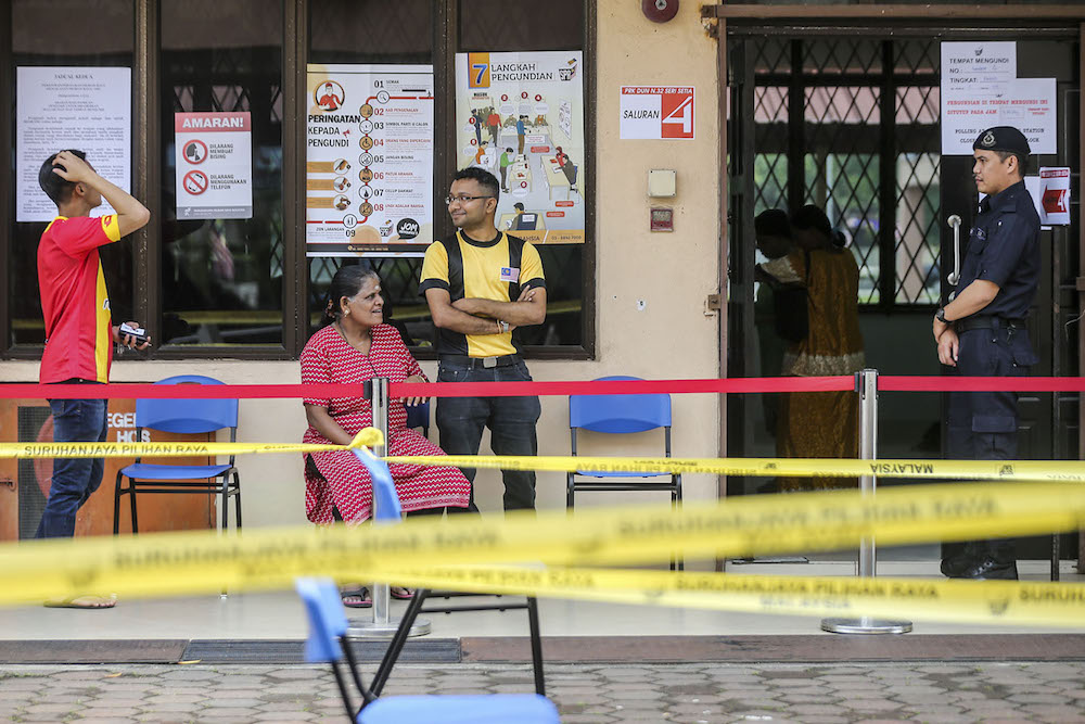 Voters wait to cast their ballots during the Seri Setia by-election at Politeknik Sultan Salahuddin Abdul Aziz Shah in Shah Alam September 8, 2018. u00e2u20acu201d Picture by Hari Anggara