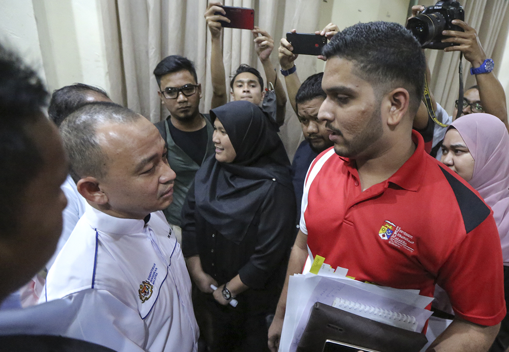 Student activist Asheeq Ali (right) meets Education Minister Dr Maszlee Malik after a meeting with a group of students in Kuala Lumpur September 12, 2018. u00e2u20acu201d Picture by Azneal Ishak