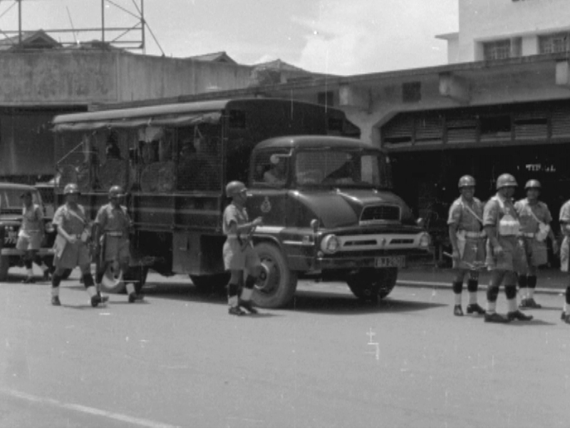 The Malaysian police’s anti-riot squad in Singapore in September 1964. — Screen capture via Reuters archive footage