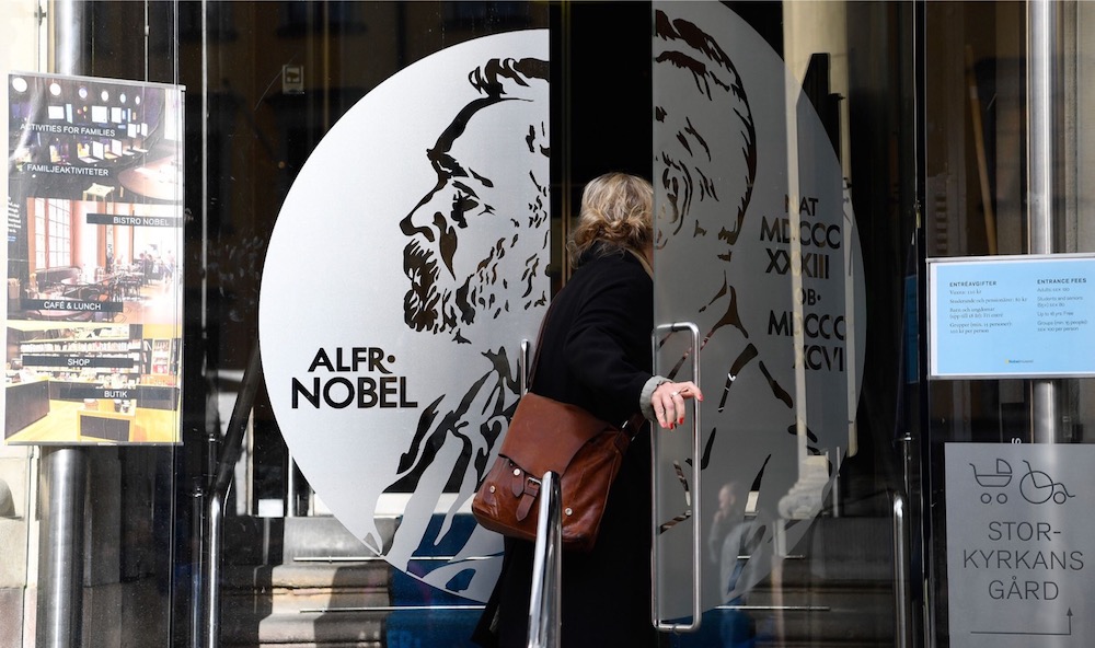A woman opens the door of the Alfred Nobel Museum in Stockholm, that is located in the building of the Swedish Academy, where traditionally the winners of the Nobel Prize in Literature are announced. u00e2u20acu201d AFP pic