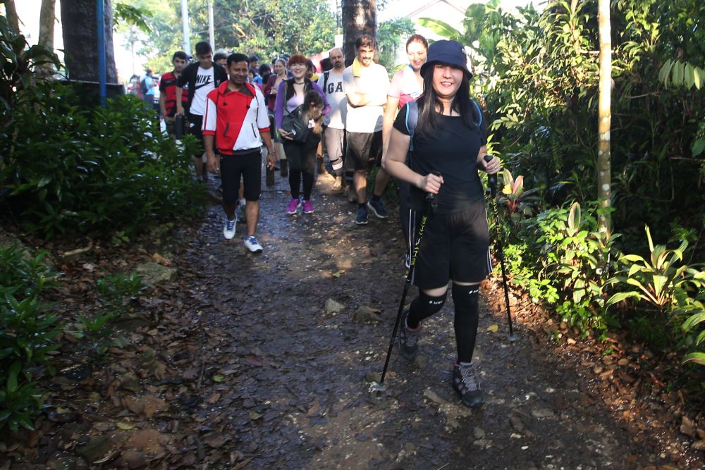 Akiko Ijitsou is a Japanese expat who takes refugee kids for hikes at Bukit Gasing, Sseptember 23, 2018. u00e2u20acu2022 Picture by Azinuddin Ghazali