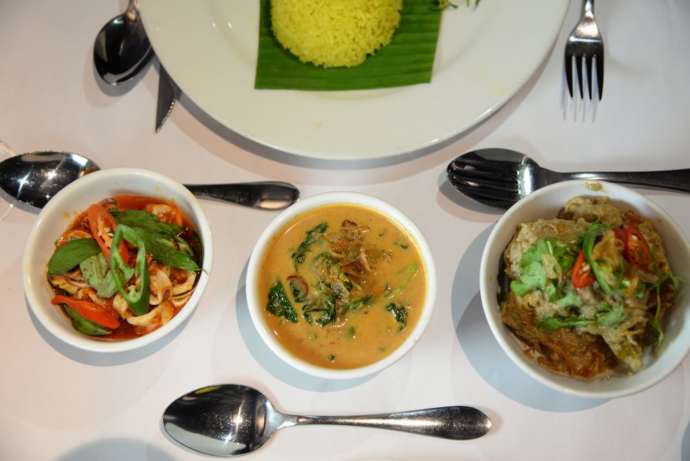 (From left) Heritage dishes by Chef Damian D’Silva ― sambal belado with cuttlefish, masak lemak with herbs and leaves and opor Ayam.