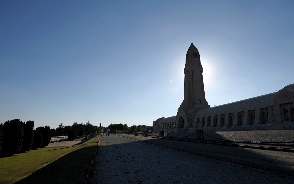 In this file photo taken on September 3, 2013, visitors walk outside the ossuary of Douaumont in eastern France. The ossuary houses remains of soldiers who died on the Verdun battlefield during World War I. u00e2u20acu201d AFP pic