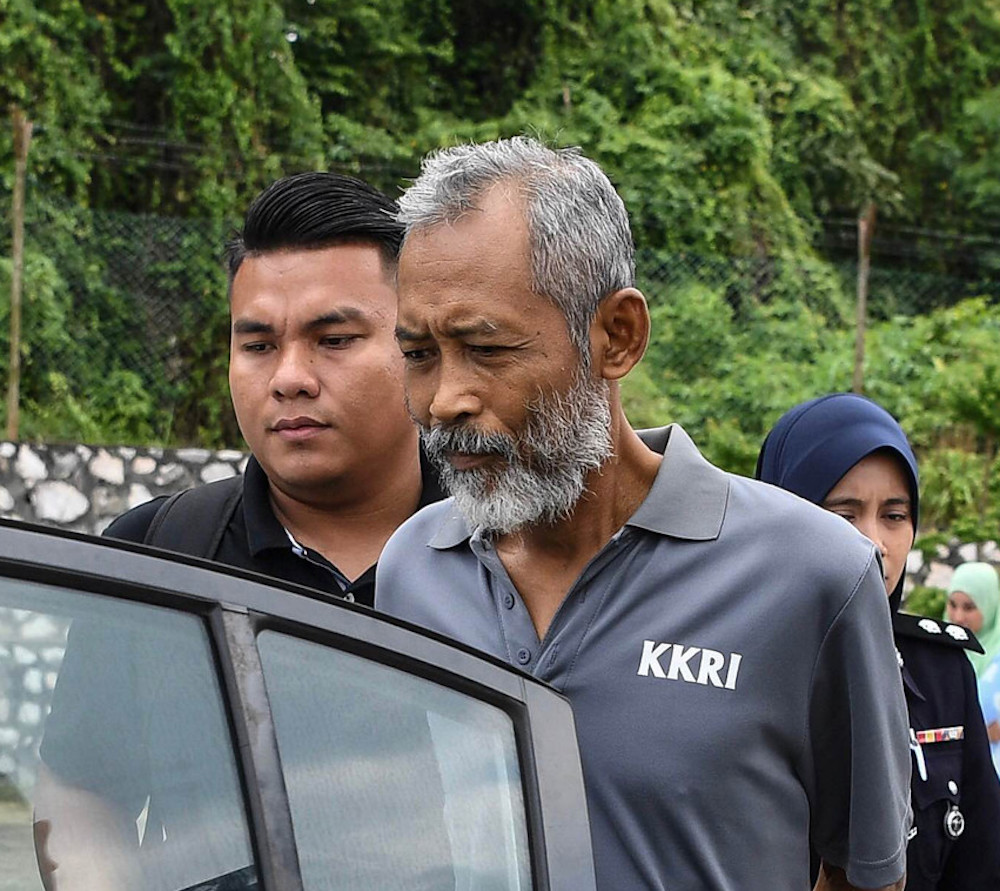 Mohd Halin Jabar is brought to the Magistrateu00e2u20acu2122s Court in Parit September 12, 2018. u00e2u20acu201d Bernama pic