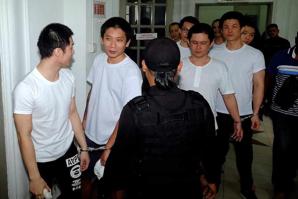 Suspected Jee Jin Tong members are brought to the Magistrateu00e2u20acu2122s Court in Johor Baru September 12, 2018. u00e2u20acu201d Bernama pic