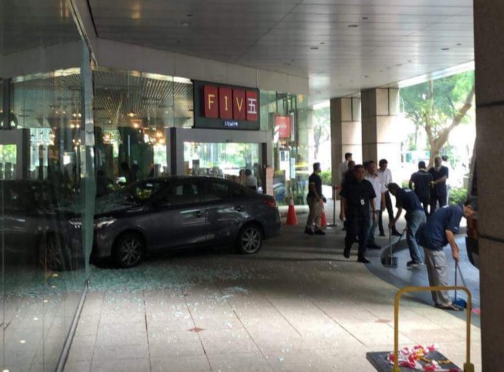 A car is seen turning into the drop-off point of the building when it mounted the kerb before it smashed into the glass facade of Five Square bar. u00e2u20acu201d Picture courtesy of social media/TODAY