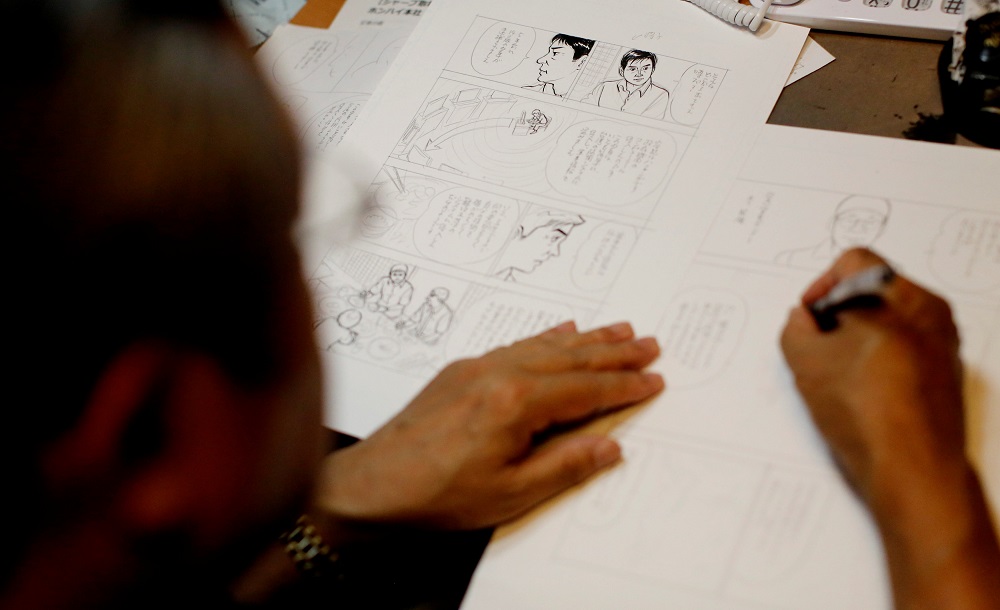 Kenshi Hirokane, the comic book author of the Kosaku Shima and ‘Like Shooting Stars in the Twilight’ series, works at his studio in Tokyo September 10, 2018. — Reuters pic      