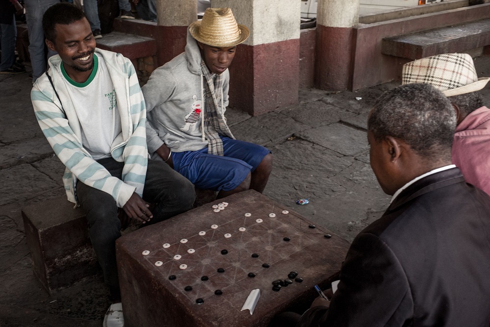 Jean-Marie Andriatsarafara (right), known as Zamabe, 30, a player of Fanorona since the age of 11 years and champion of Madagascar since 2016, plays a game of Fanorona in the capital Antananarivo on June 20, 2018. u00e2u20acu201d AFP pic