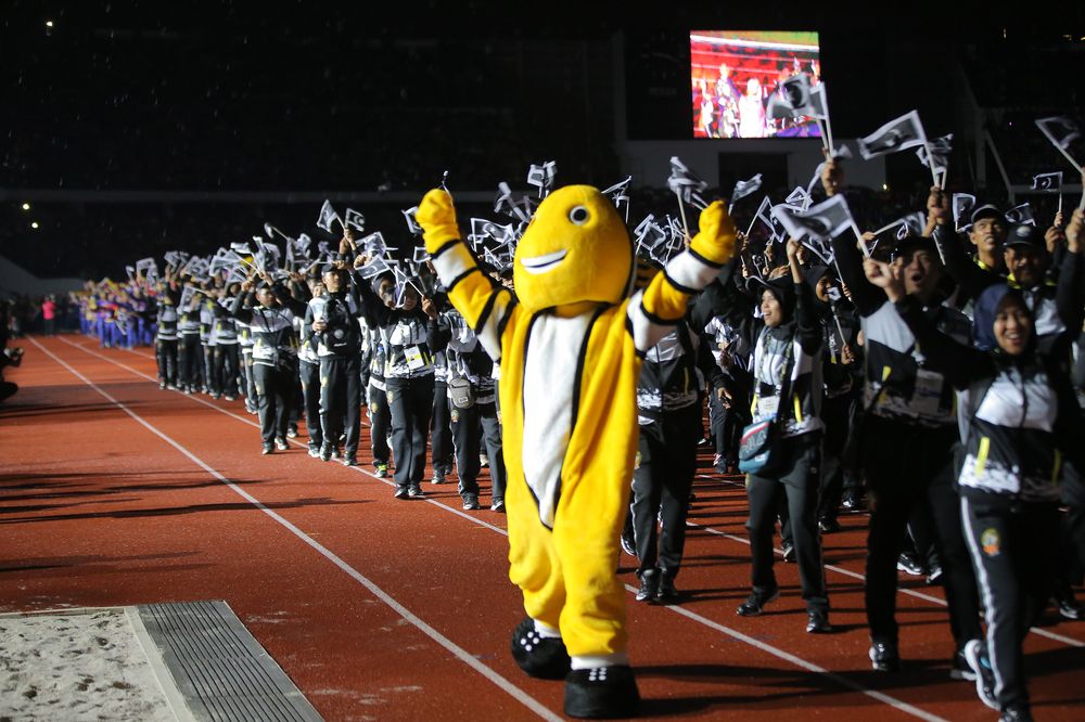After the march past, the Perak Sukma mascot, a seladang bull named Chor entered the field. u00e2u20acu201d Picture by Marcus Pheong