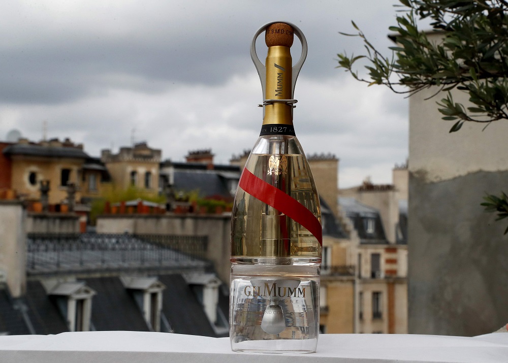 A picture taken on September 6, 2018 in Paris shows a bottle of Mumm Grand Cordon Stellar champagne that will be tasted by space tourists using a container bottle adapted to pour the bubbly liquid in zero gravity conditions. u00e2u20acu201d AFP pic