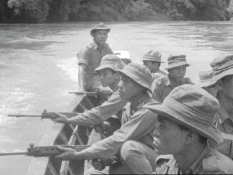 First Sarawak Rangers with rifles patrol Sarawak in a longboat amid ongoing clashes with Indonesian forces. u00e2u20acu201d Screengrab from Reuters archive footage 