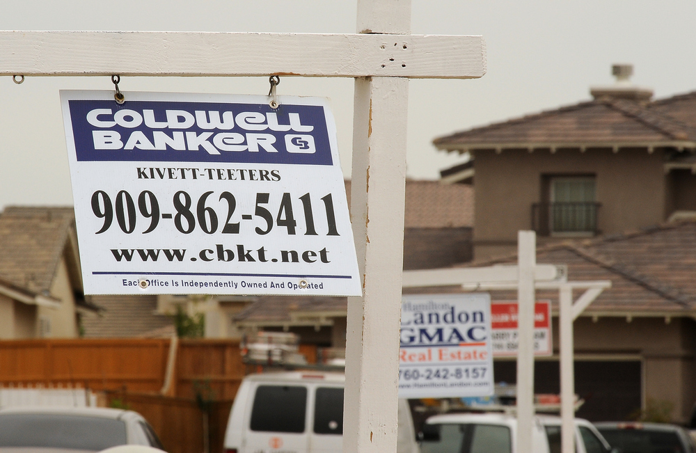 In this file photo taken on June 15, 2009 for sale signs line a residential street in Adelanto, in the Mojave Desert, about 135 km from Los Angeles, the first day of a statewide 90-day moratorium on housing foreclosures.  u00e2u20acu201d AFP pic