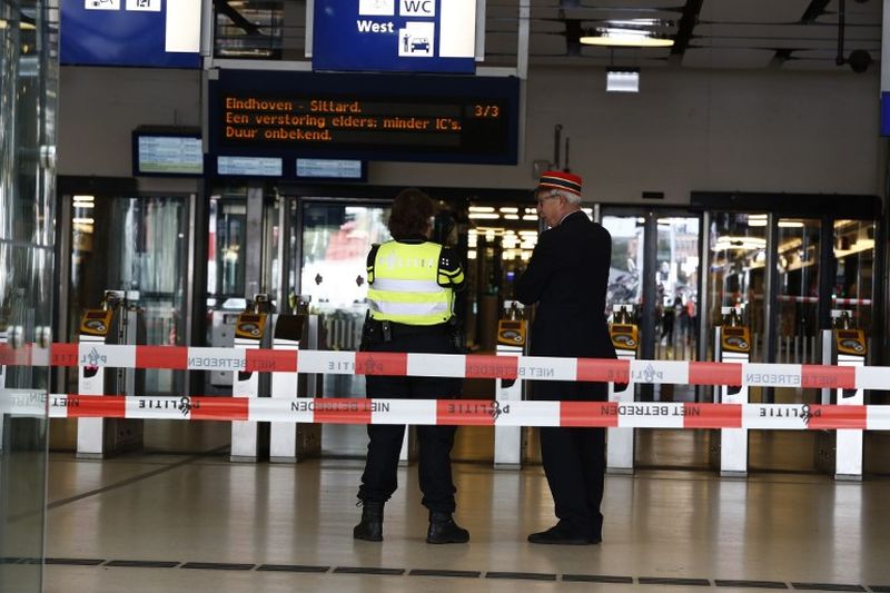 Officials stand inside a cordonned-off area at The Central Railway Station in Amsterdam on August 31, 2018, after two people were injured in a stabbing incident. u00e2u20acu2022 AFP pic