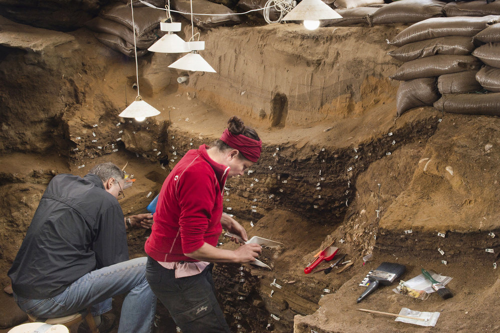 Researchers work inside Blombos Cave on South Africa's southern coast in this photo released September 12, 2018. — Magnus M. Haaland/Handout via Reuters