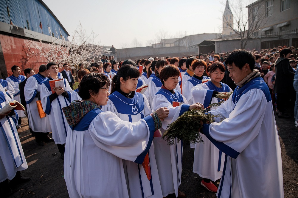 Believers prepare for the Palm Sunday procession held by the government-sanctioned Catholic church in Youtong village, Hebei province, China, March 25, 2018. u00e2u20acu201d Reuters pic