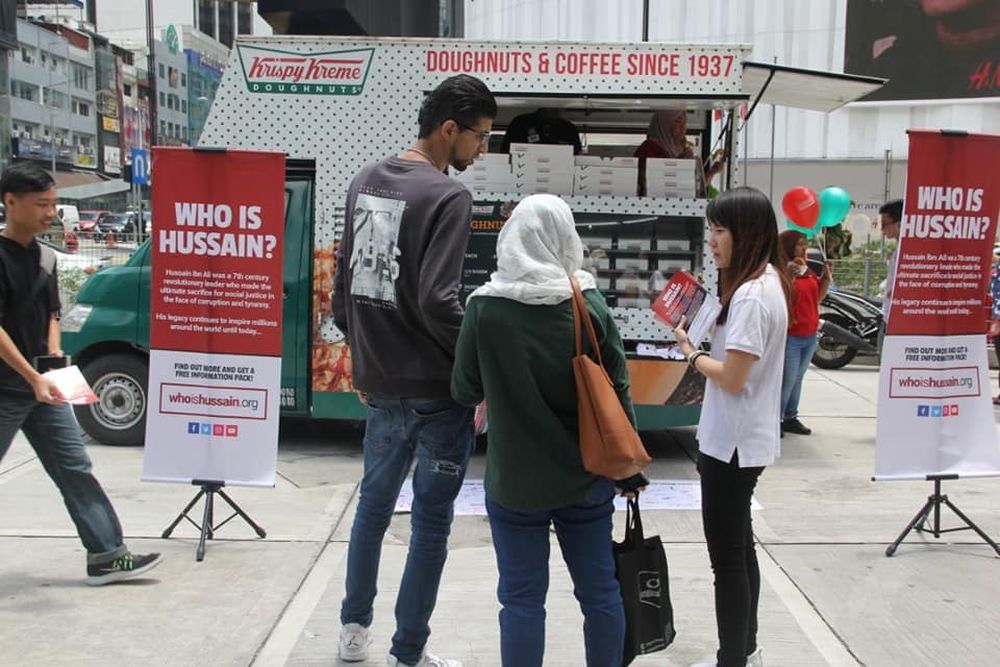 Who is Hussain volunteers give out free donuts to passers-by in Bukit Bintang September 22, 2018. u00e2u20acu2022 Picture courtesy of Who is Hussain