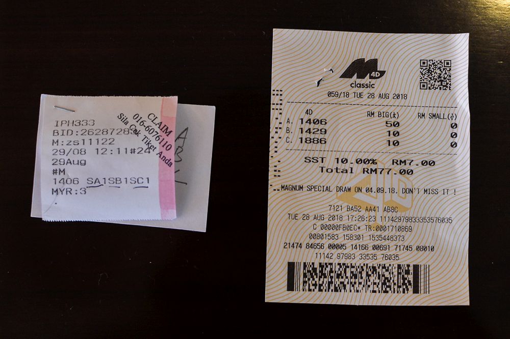 Spot the difference: An illegal gaming ticket (left) and legal ticket by Magnum 4D (right) in Kuching.