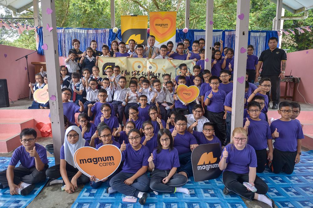 Participating students pose for group photo after receiving their spectacles during the ‘I Can See Clearly Now’ Spectacles Presentation & Eye Awareness Talk at SK Atas Singai in Kuching August 29, 2018.