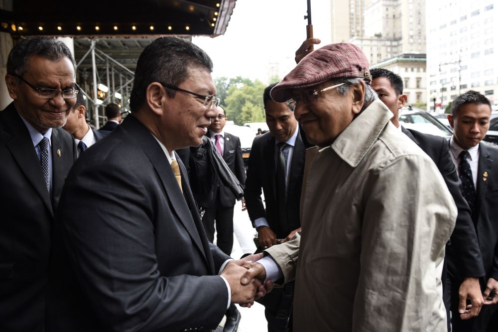 Prime Minister Tun Dr Mahathir Mohamad (right) is greeted by Datuk Saifuddin Abdullah upon his arrival in New York for the United Nations General Assembly September 26, 2018. u00e2u20acu201d Picture courtesy of the Department of Information Malaysia