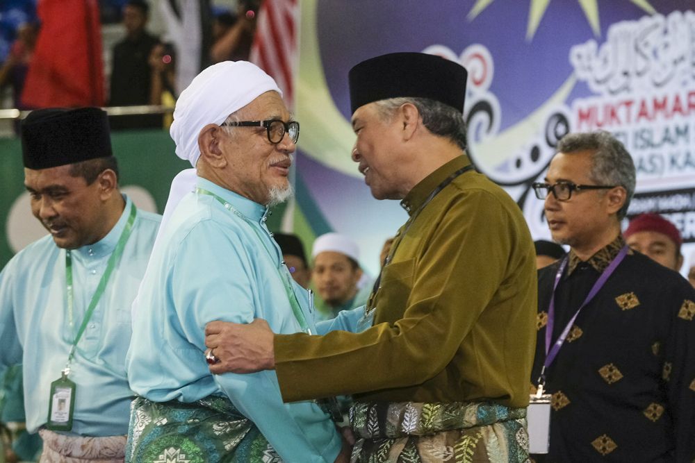 Datuk Seri Abdul Hadi Awang (left) greets Datuk Seri Ahmad Zahid Hamidi at the PAS Muktamar in Kuala Terengganu September 15, 2018. u00e2u20acu2022 Picture by Azneal Ishak