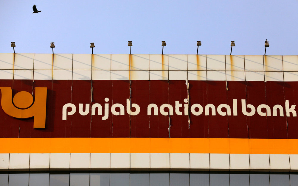 A bird flies past the logo of Punjab National Bank installed on the facade of its office in Mumbai, India February 21, 2018. u00e2u20acu201d Reuters pic