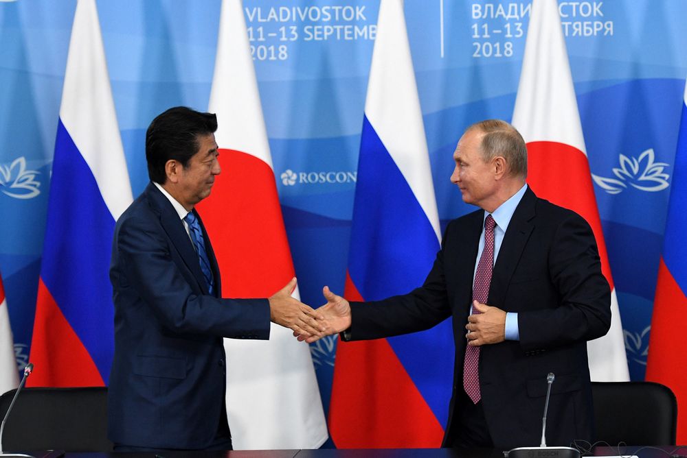 Russian President Vladimir Putin shakes hands with Japanese Prime Minister Shinzo Abe during a news conference following their meeting on the sidelines of the Eastern Economic Forum in Vladivostok, September 10, 2018. u00e2u20acu201d Reuters pic