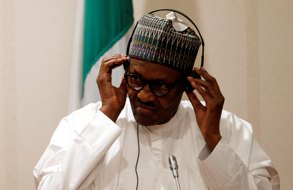Nigeriau00e2u20acu2122s President Muhammadu Buhari adjusts his translation device during a news conference at the presidential villa in Abuja August 31, 2018. u00e2u20acu201d Reuters pic