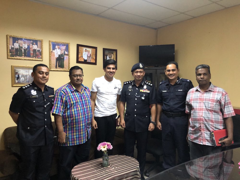 Syed Saddiq meets with Sabah police following the arrest of eight activists in Kota Kinabalu September 16, 2018. u00e2u20acu201d Picture via Twitter/SyedSaddiq