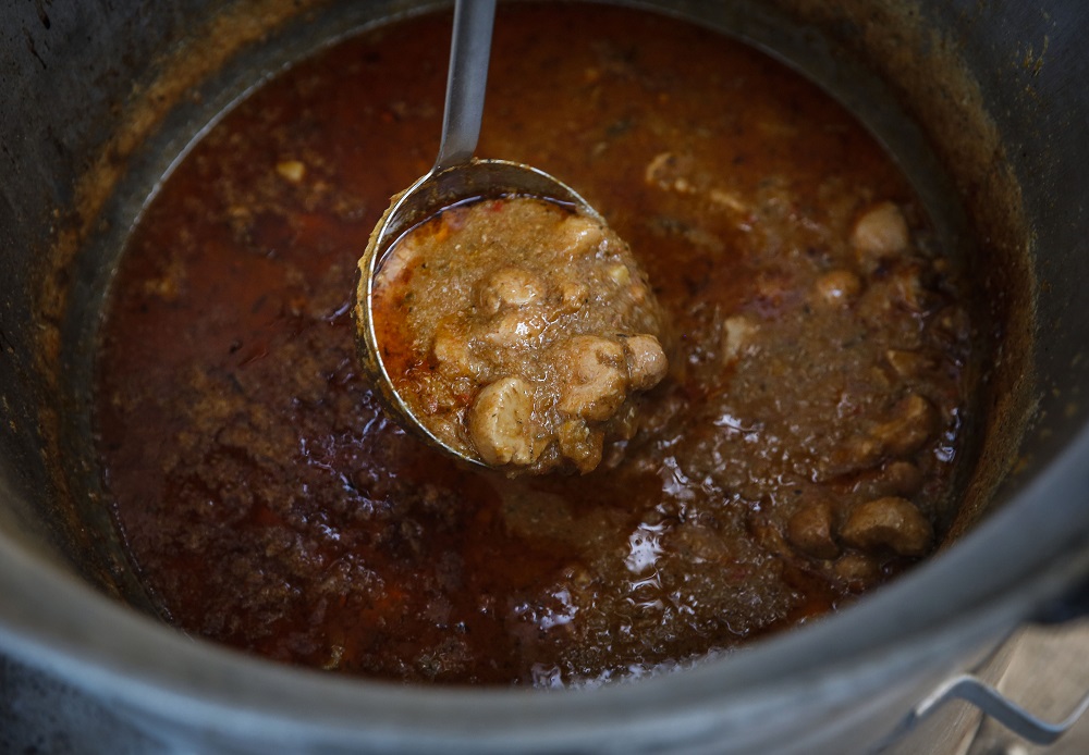 A participant of the 15th annual World Testicle Cooking Championship known as the Ball Cup prepares a dish in the village of Lipovica on September 1, 2018. u00e2u20acu201d AFP pic