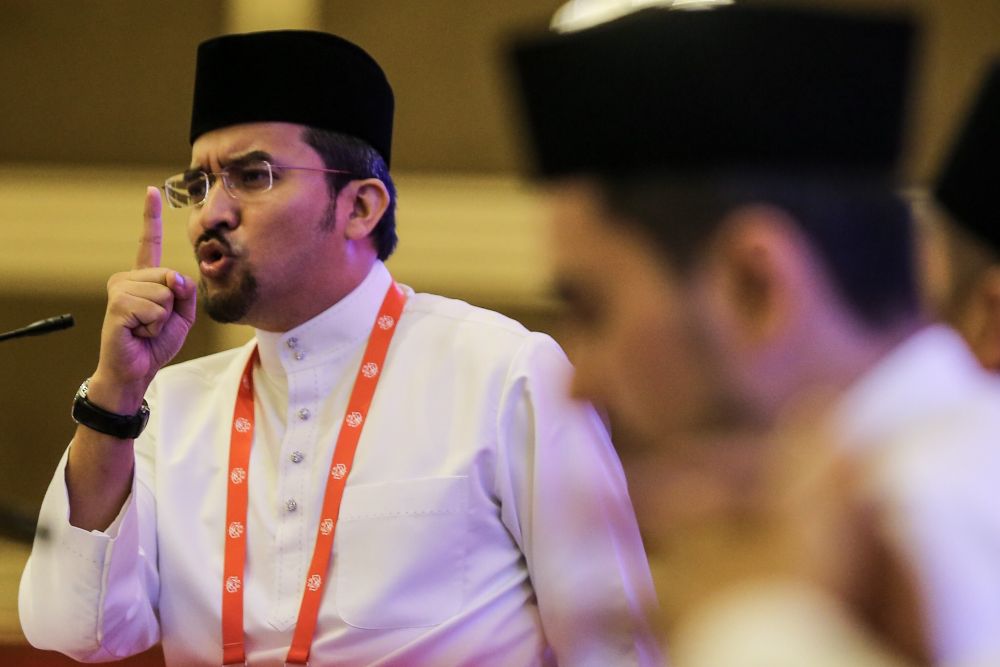 Umno Youth chief Datuk Asyraf Wajdi Dusuki speaks during the 2018 Umno General Assembly in Kuala Lumpur September 29, 2018. u00e2u20acu2022 Picture by Hari Anggara