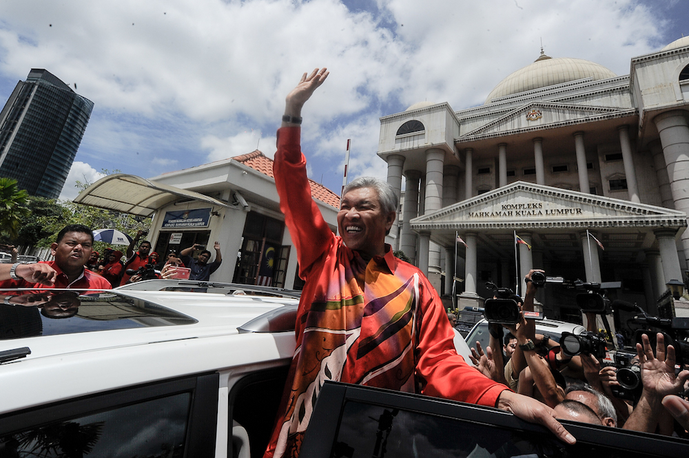 Umno president Datuk Seri Ahmad Zahid Hamidi gestures as he leaves the Kuala Lumpur High Court Complex October 19, 2018. u00e2u20acu201d Picture by Shafwan Zaidon