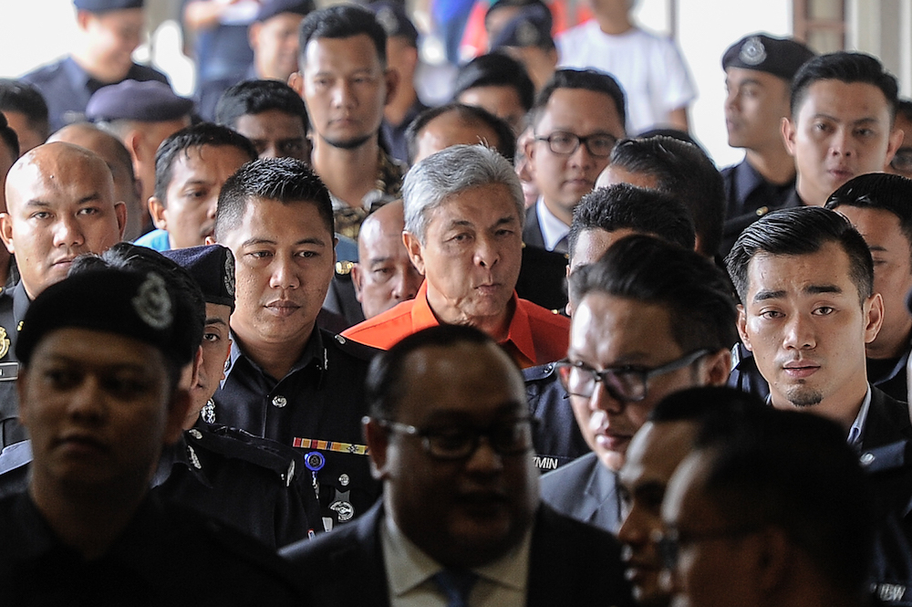 Umno president Datuk Seri Ahmad Zahid Hamidi leaves the Kuala Lumpur High Court Complex after his court hearing, October 19, 2018. u00e2u20acu201d Picture by Shafwan Zaidon