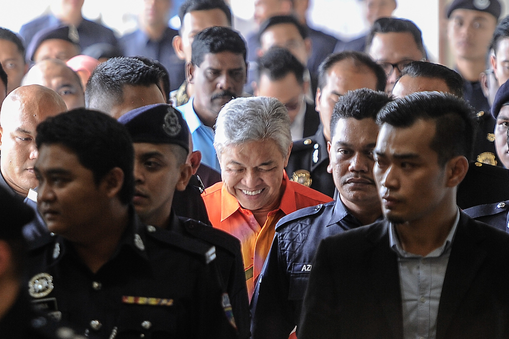 Umno president Datuk Seri Ahmad Zahid Hamidi leaves the Kuala Lumpur High Court Complex after his court hearing, October 19, 2018. u00e2u20acu201d Picture by Shafwan Zaidon