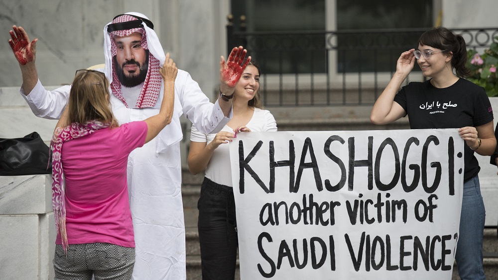 A demonstrator dressed as Saudi Arabian Crown Prince Mohammed Salman with blood on his hands protests with others outside the Saudi Embassy in Washington, DC, on October 8, 2018. u00e2u20acu201d AFP pic