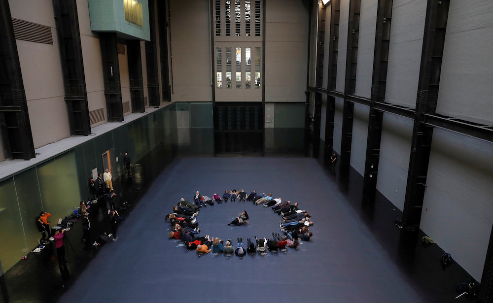 Cuban artist Tania Bruguera sits in the middle of her Hyundai Commission artwork, ‘Our Neighbours’, in the Turbine Hall of Tate Modern, London October 1, 2018. — Reuters pic