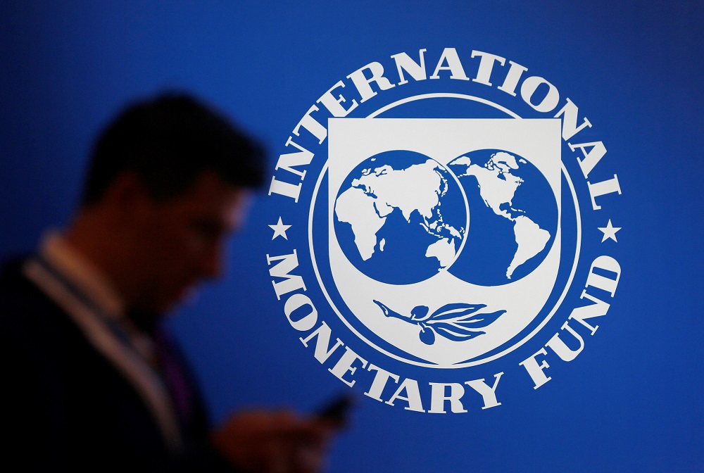 A participant stands near a logo of IMF at the International Monetary Fund u00e2u20acu201d World Bank Annual Meeting 2018 in Nusa Dua October 12, 2018. u00e2u20acu201d Reuters pic