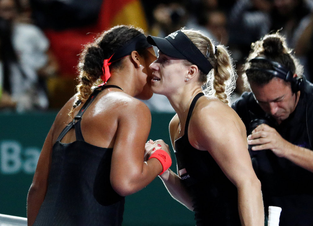 Germanyu00e2u20acu2122s Angelique Kerber shakes hands with Japanu00e2u20acu2122s Naomi Osaka after winning their group stage match at the WTA Tour Finals in Singapore October 24, 2018. u00e2u20acu201d Reuters pic