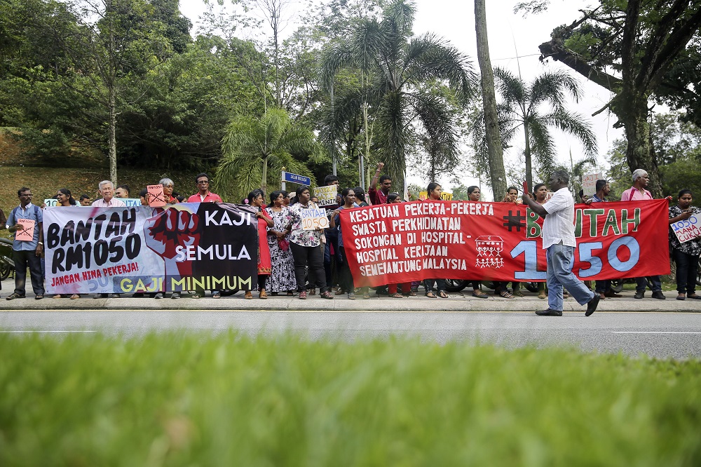 Demonstrators hold placards and banners during the Bantah 1050 rally to protest against the minimum wage at Padang Merbok in Kuala Lumpur October 17, 2018. u00e2u20acu201d Picture by Yusof Mat Isa