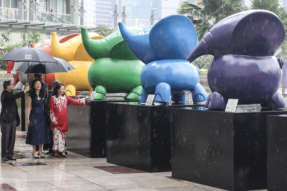 Hospice Malaysia Chairman Datin Kathleen Chew (2nd left) and Hannah Yeoh visit the baby elephant sculptures at KLCC Park Esplanade, Kuala Lumpur October 1, 2018. u00e2u20acu201d Picture by Hari Anggara