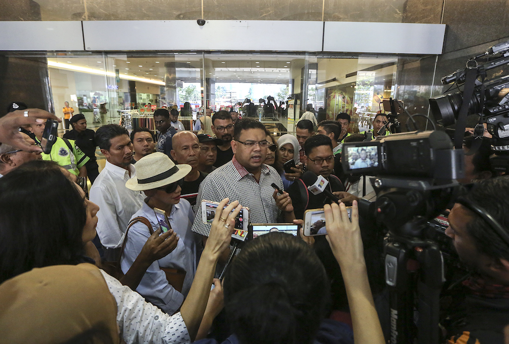 Datuk Lokman Noor Adam speaks to reporters in the lobby of the Bukit Aman Commercial Crimes Investigations Department (CCID) headquarters in Kuala Lumpur October 3, 2018. — Picture by Azneal Ishak