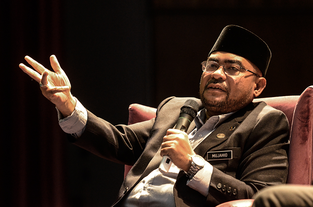 Minister in the Prime Minister's Department Datuk Mujahid Yusof Rawa speaks during a dialogue session at Universiti Malaya in Kuala Lumpur October 10, 2018. u00e2u20acu201d Picture by Miera Zulyana