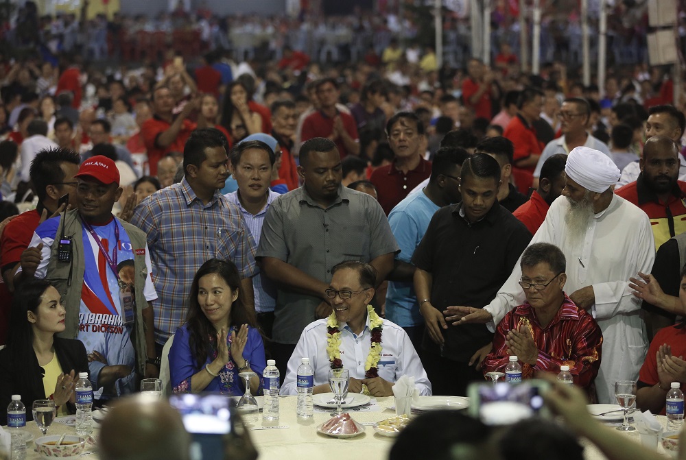 Datuk Seri Anwar Ibrahim attends a dinner with supporters at a local temple in Lukut.