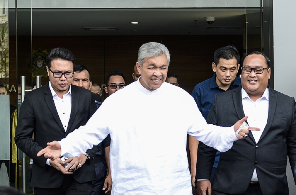 Umno president Datuk Seri Zahid Hamidi leaves the MACC headquarters to perform Friday prayers after giving his statement in Putrajaya October 12, 2018. u00e2u20acu201d Picture by Miera Zulyana