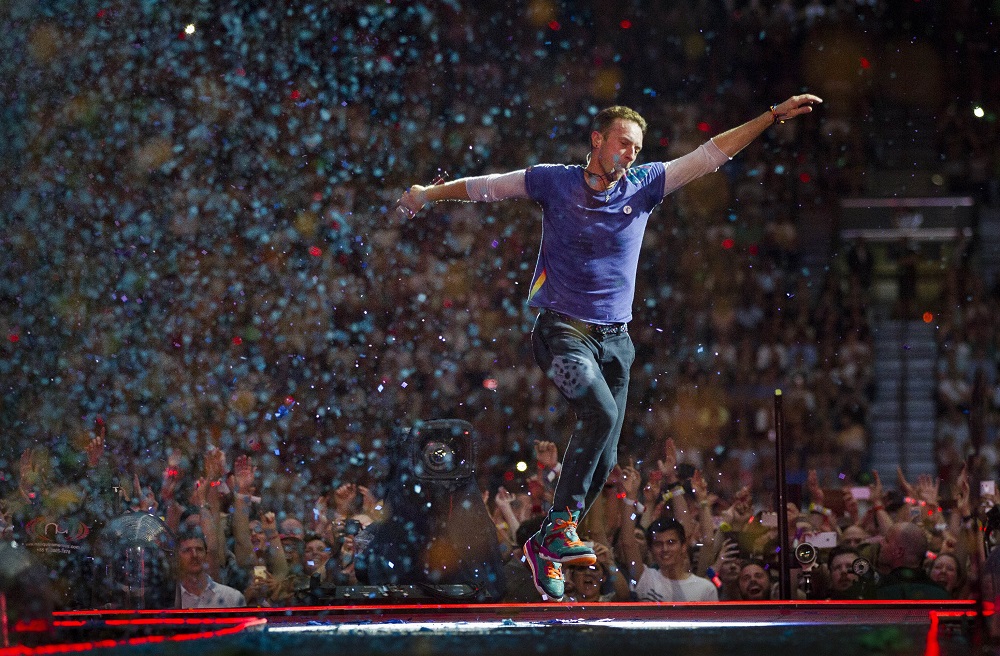 English singer-songwriter Chris Martin, frontman of British rock band Coldplay, performs on stage at the ArenA Stadium in Amsterdam on June 23, 2016, during a concert presenting the bandu00e2u20acu2122s latest album u00e2u20acu02dcA Head Full of Dreams.u00e2u20acu2122 u00e2u20acu201d AFP pic