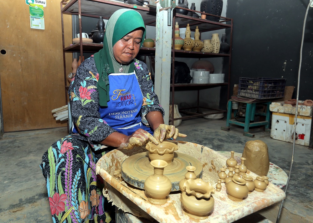 The sayong is made of clay and requires skilful hands to shape and craft the designs.