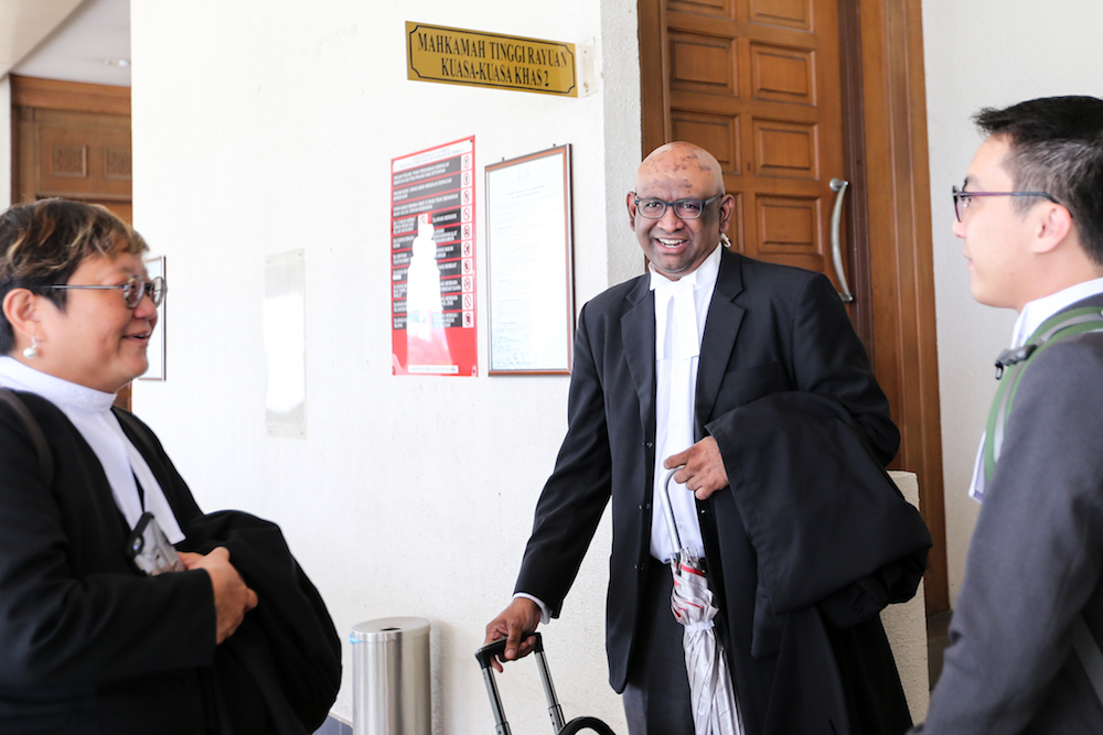 Lawyers K. Shanmuga, Honey Tan and Matt Wong are seen at the Kuala Lumpur High Court October 16, 2018. u00e2u20acu201d Picture by Ahmad Zamzahuri