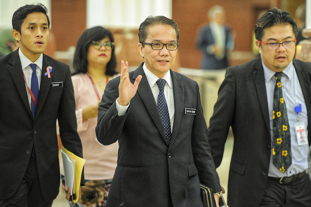 Minister in the Prime Ministeru00e2u20acu2122s Department, Datuk Liew Vui Keong (centre), arrives at Parliament in Kuala Lumpur October 16, 2018. u00e2u20acu201d Picture by Shafwan Zaidon