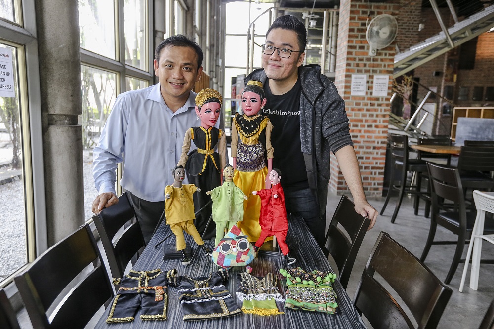 Easee Gan (right) and Loy Chee Luen of the Malaysian Puppetry Association will present a street puppet performance on wheels for Urbanscapes. u00e2u20acu201d Pictures by Firdaus Latif